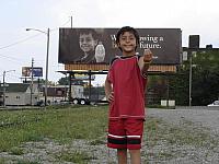 Wes in front of ad he posed for